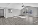 Open living room with high ceilings and grey vinyl flooring at 116 Brentwood Dr. # E, Murrells Inlet, SC 29576