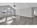 Spacious living room with vaulted ceiling and grey vinyl flooring at 116 Brentwood Dr. # E, Murrells Inlet, SC 29576