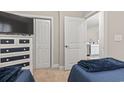 View of a bedroom with two twin beds, dresser, and a view of the kitchen at 157 Ella Kinley Circle # 303, Myrtle Beach, SC 29588