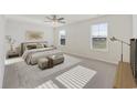 Bright bedroom with a plush bed and large windows at 219 Marauder Dr., Longs, SC 29568
