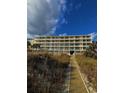 Building exterior, beach access path, and dune landscape at 3217 S Ocean Blvd. S, North Myrtle Beach, SC 29582