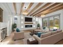Spacious living room featuring hardwood floors, fireplace, and access to a patio at 4048 Girvan Dr., Myrtle Beach, SC 29579