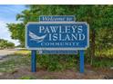 Welcome sign to Pawleys Island Community, the oldest seaside resort in America at 42 Mud Minnow Dr., Pawleys Island, SC 29585