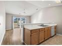 Simple kitchen with light wood cabinets and access to a balcony at 448 Red River Ct. # 39H, Myrtle Beach, SC 29579