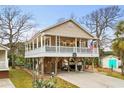 Elevated beach home with large deck and parking underneath at 6001 - 7032 S Kings Hwy., Myrtle Beach, SC 29575