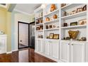 White built-in shelving and hardwood floors in entryway at 645 Lafayette Park Dr., Little River, SC 29566