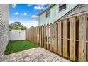 Private backyard with grassy area and paved patio at 829 9Th Ave. S, North Myrtle Beach, SC 29582