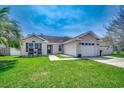 Charming one-story home featuring a well-manicured lawn, neutral siding, and attached garage at 9650 Bradford Ln., Murrells Inlet, SC 29576