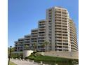 Stunning exterior view of the condo showcasing multiple balconies and lush landscaping at 100 Ocean Creek Blvd. # J1, Myrtle Beach, SC 29572
