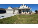 Two-story house with a two-car garage and front porch at 1108 Oxeye St., North Myrtle Beach, SC 29582