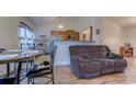 Open living space with a comfortable couch and views of the kitchen at 121 Cottage Creek Circle, Conway, SC 29527