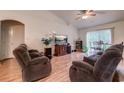 Spacious living room with hardwood floors, two recliners, and a large TV at 121 Cottage Creek Circle, Conway, SC 29527