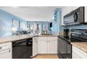Modern kitchen with black appliances and granite countertops at 1605 S Ocean Blvd. # 414, Myrtle Beach, SC 29577