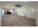 Spacious living room featuring hardwood floors, crown molding, and a ceiling fan at 1718 26Th Ave. N, North Myrtle Beach, SC 29582