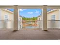 Picturesque balcony view overlooking the condo complex's charming pond and fountain at 2080 Cross Gate Blvd. # 303, Surfside Beach, SC 29575