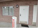 Exterior condo entrance with brick walls and white door at 241 Presidential Dr., Surfside Beach, SC 29575