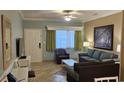 Living room with sofa, chair, and large picture at 241 Presidential Dr., Surfside Beach, SC 29575