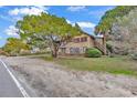 Two-story beach house with screened porch, mature landscaping and ocean view at 298 Myrtle Ave., Pawleys Island, SC 29585