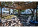 Relaxing patio with pergola, seating, and outdoor heater at 301 North Main St., Hemingway, SC 29554