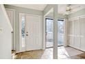 Bright entryway with tiled floors, white door, and access to the backyard at 38 Shadow Moss Pl. # 38, North Myrtle Beach, SC 29582