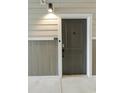 Modern apartment building front door entrance with sleek design at 395 S Crow Creek Dr. # 1621, Calabash, NC 28467