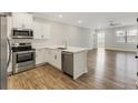 Open concept kitchen with island and living room view at 395 S Crow Creek Dr. # 1621, Calabash, NC 28467