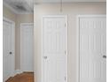 Hallway with three closed doors and hardwood floors at 408 S 16Th Ave. S, Myrtle Beach, SC 29577
