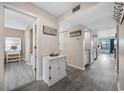 Bright condo hallway featuring stylish gray floors, white accents, and nautical decor for a fresh, coastal feel at 501 Maison Dr. # F12, Myrtle Beach, SC 29572