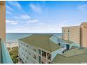 Balcony view of beach and ocean at 501 S Ocean Blvd. # 708, North Myrtle Beach, SC 29582