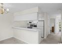 Kitchen with white cabinets and stainless steel appliances at 5060 Windsor Green Way # 203, Myrtle Beach, SC 29579
