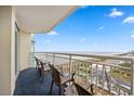 Private balcony with stunning ocean views and comfortable seating at 5200 N Ocean Blvd. # 1154, Myrtle Beach, SC 29577