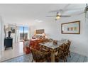 Living room with dining area, sofa, and balcony access at 601 Mitchell Dr. # 1002, Myrtle Beach, SC 29577