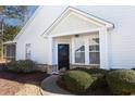 Front entrance with black door and landscaping at 6095 Catalina Dr. # 2611, North Myrtle Beach, SC 29582