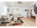 Spacious living room with L-shaped sofa and hardwood floors at 6095 Catalina Dr. # 2611, North Myrtle Beach, SC 29582