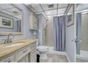 Small bathroom with shower/tub combo and light vanity at 7601 North Ocean Blvd. # 1B, Myrtle Beach, SC 29572
