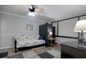 Small bedroom with a sleeper sofa and carpet flooring at 7601 North Ocean Blvd. # 1B, Myrtle Beach, SC 29572