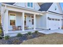 Inviting front porch with rocking chairs, adding to the home's charm at 848 Commanders Island Rd., Georgetown, SC 29440