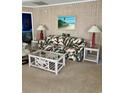 Living room with sofa and rattan coffee table at 121 Marshland Ct., Myrtle Beach, SC 29572