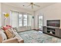 Living room with access to balcony, neutral colors at 1302 River Oaks Dr. # 4-F, Myrtle Beach, SC 29579