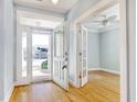 Bright foyer with wood floors, pale blue walls and view to a bonus room at 1405 Surf Pointe Dr., North Myrtle Beach, SC 29582
