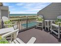 Private balcony with ocean views and comfortable seating at 1820 N Ocean Blvd. # 305E, North Myrtle Beach, SC 29582