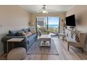 Bright living room with ocean views and comfortable seating at 1820 N Ocean Blvd. # 305E, North Myrtle Beach, SC 29582