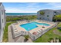 Inviting oceanfront pool with plenty of lounge chairs at 1820 N Ocean Blvd. # 305E, North Myrtle Beach, SC 29582