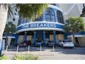 Close-up of condo building entrance with 'The Breakers' signage and covered parking at 2006 N Ocean Blvd. # 776, Myrtle Beach, SC 29577