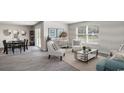Bright living room features neutral walls, a window, and stylish decor at 201 Ashworth Dr., Tabor City, NC 28463