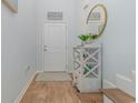 Bright entryway with wood floors and white shelving at 301 Splendor Circle, Murrells Inlet, SC 29576