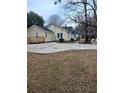 Spacious backyard with large concrete patio and wooden deck at 326 East Godbold St., Marion, SC 29571
