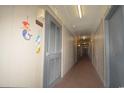 Building hallway with beach-themed wall art at 401 N Hillside Dr. # 3C, North Myrtle Beach, SC 29582