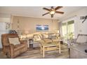 Living room with sofa, chair, and ocean-themed decor at 401 N Hillside Dr. # 3C, North Myrtle Beach, SC 29582