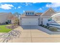 Two-car garage with driveway and landscaped front yard at 4348 Livorn Loop # 4348, Myrtle Beach, SC 29579